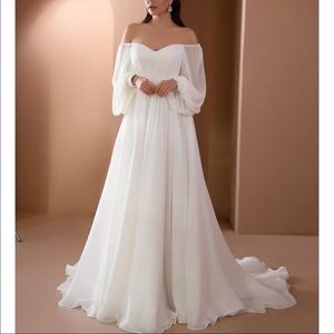 Wedding dress, brand new with tags . Fits like a US 16